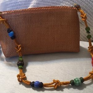 New  Hancrafted woven handbag with beaded handle.